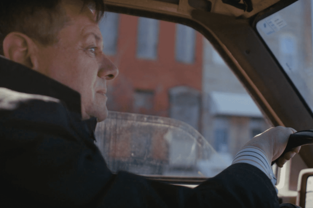 Candidate David Warnock Behind the Wheel of His Truck